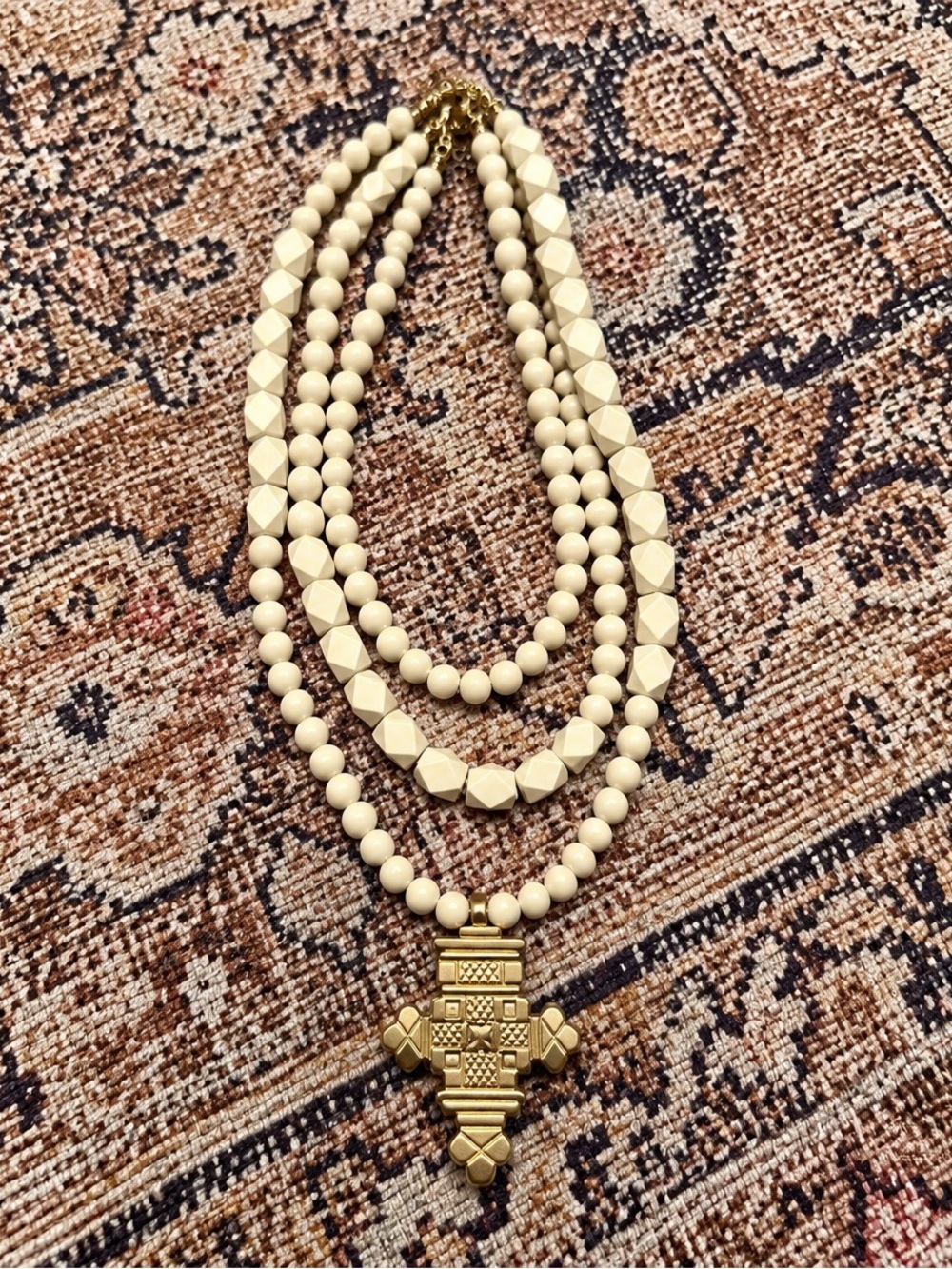 Multi-Strand Cream Beaded Necklace with Gold Cross Pendant